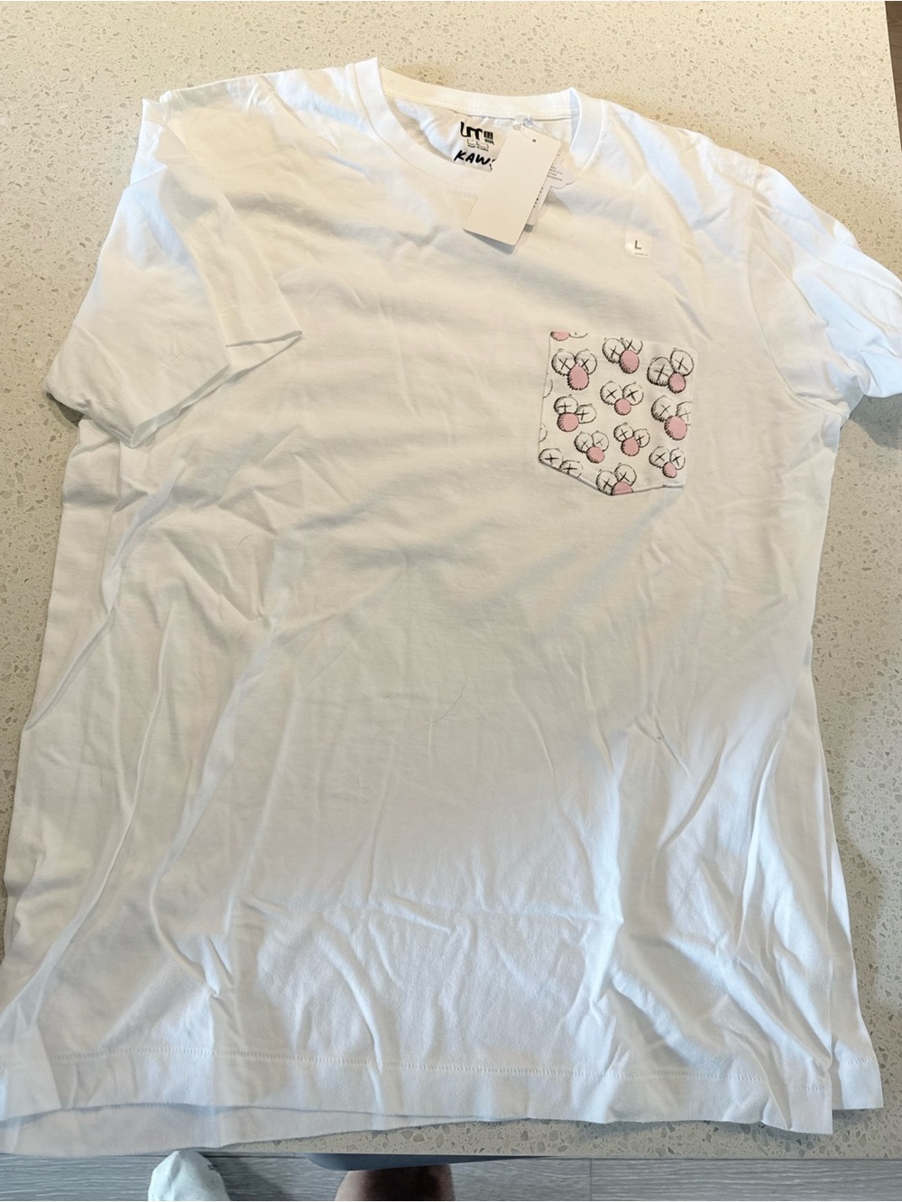 Uniqlo x KAWS White Short Sleeve Tee with Pink Pocket Motif